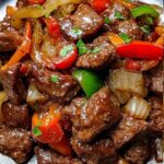 Carne Rés con Pimientos y Cebolla